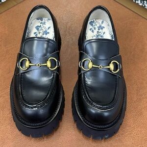 Gucci Black Loafers with Gold Hardware